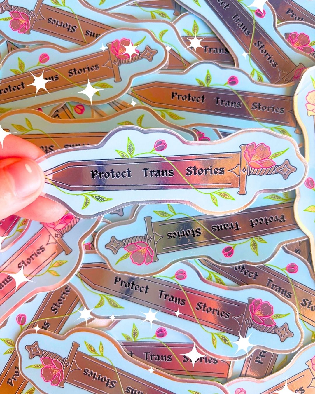 "Protect Trans Stories" Metallic 3" Sword Sticker