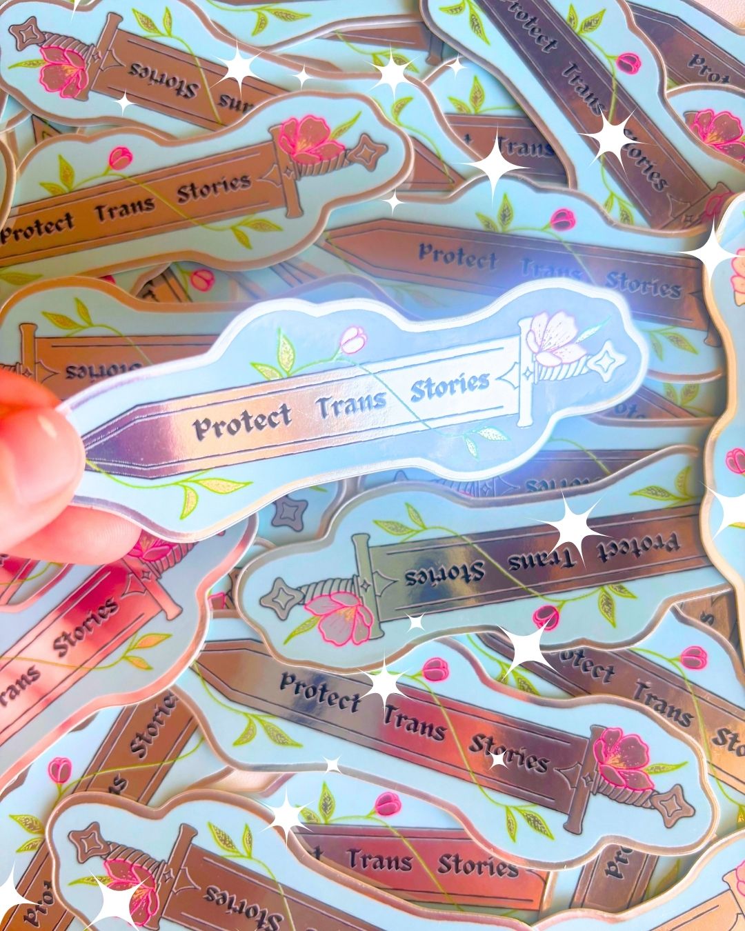"Protect Trans Stories" Metallic 3" Sword Sticker